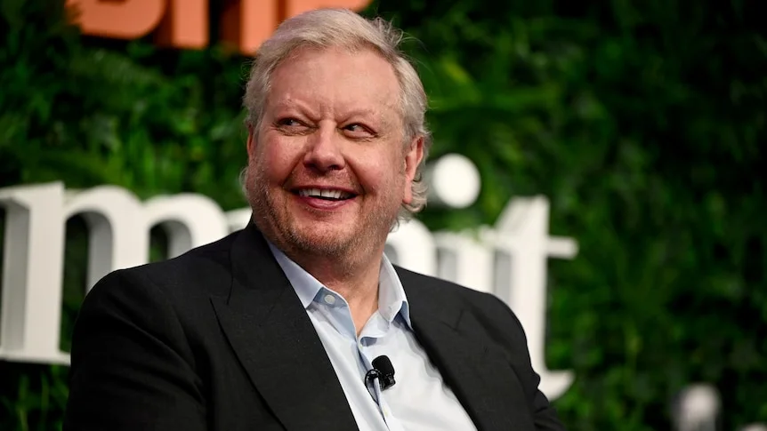 Close up of Richard White smiling on stage.