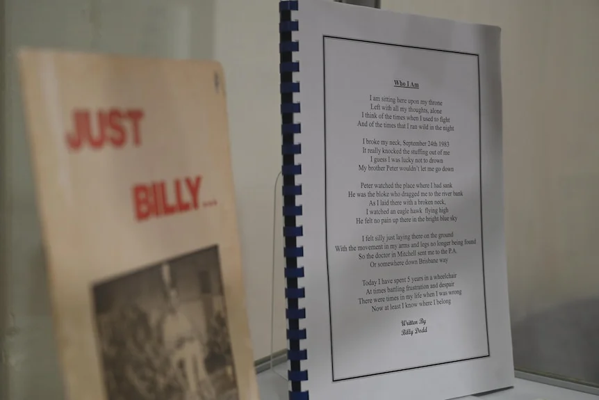 A folder of writing in an exhibitiion.