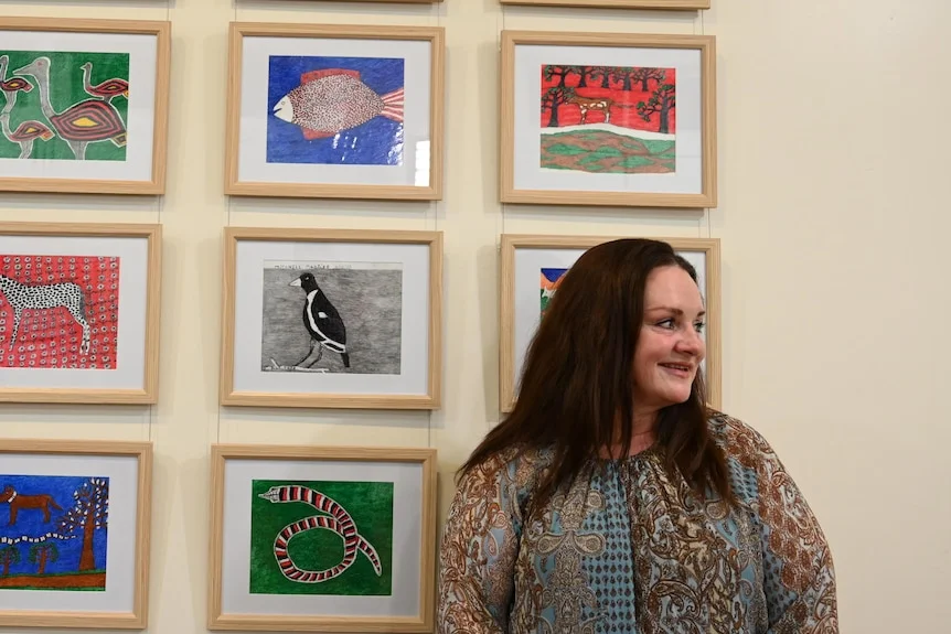 Tracy Dodd in front of Bill Dodd's art