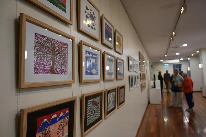 Art on the walls and some viewers.