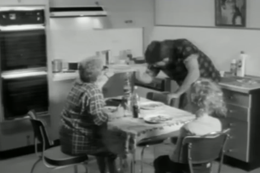 Derryn Hinch and Jackie Weaver in a black and white video