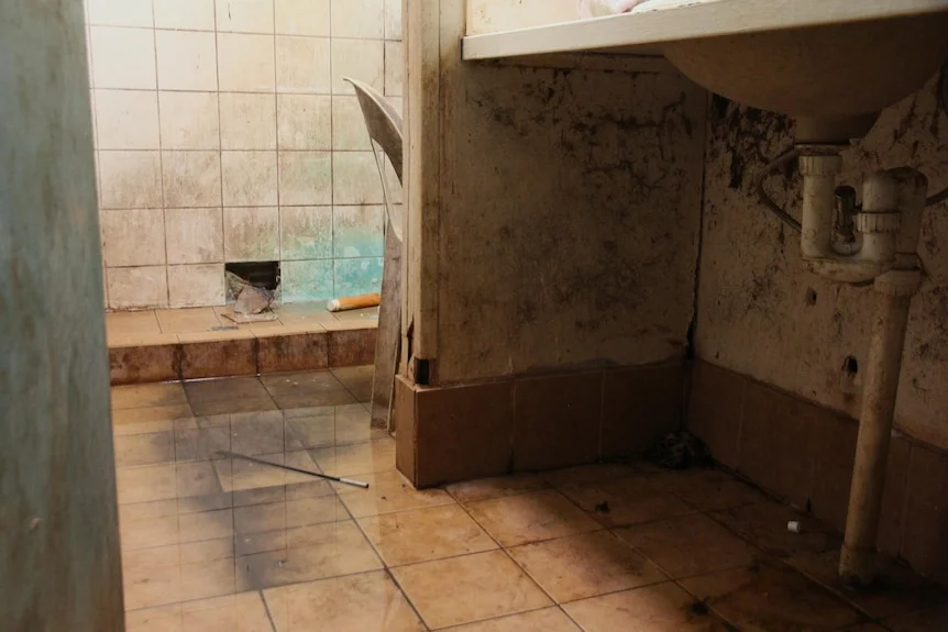 A mouldy bathroom.