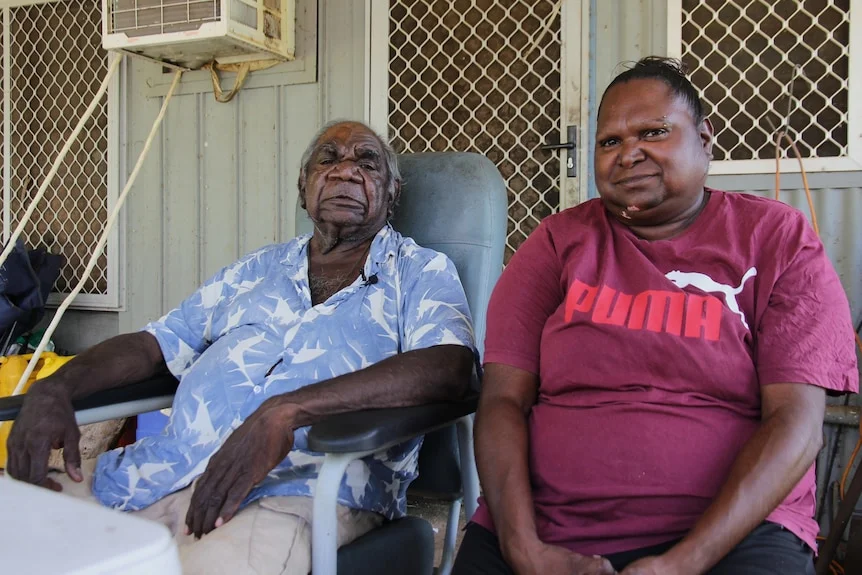 An Indigenous man and woman sitting next to each other.