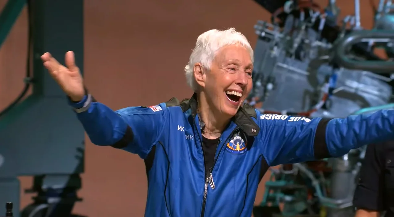 Mercury 13 aviation pioneer Wally Funk, 82, waves to a crowd after launching on Blue Origin's first crewed flight of the suborbital New Shepard rocket.