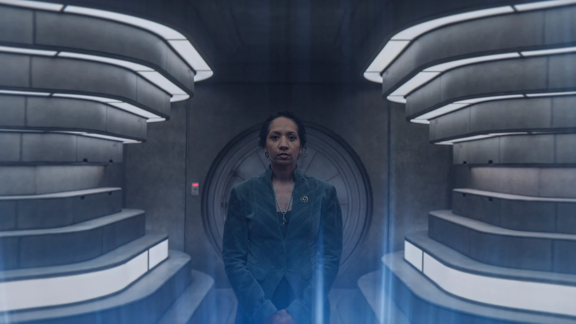 a woman in a computer room with lighted walls