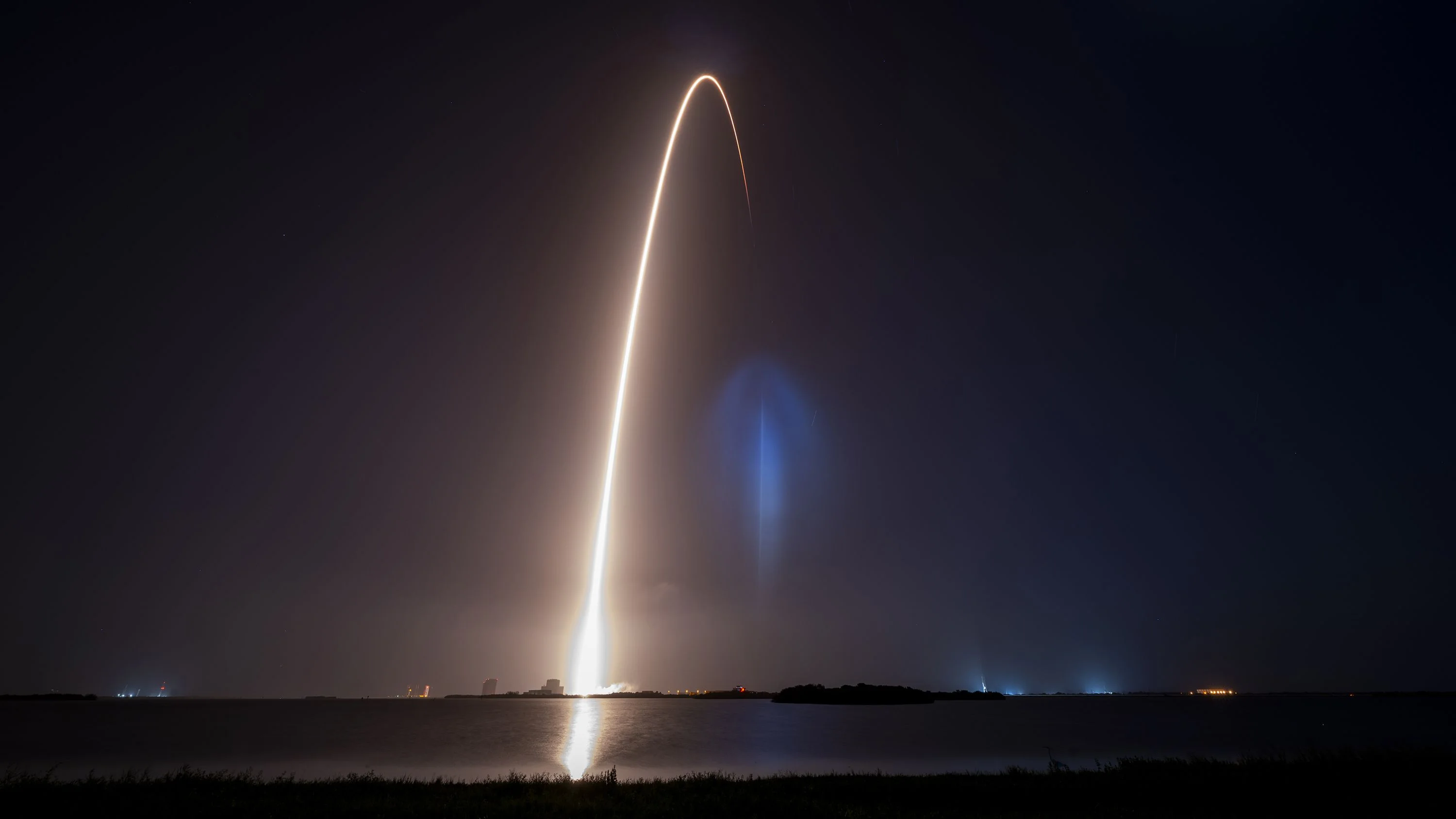 view of rocket launch streak and the rentry landing of the booster