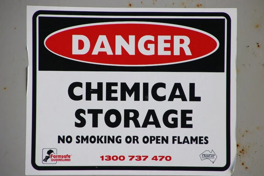 'Danger Chemical Storage' sign out the front of a chemical storage shipping container.