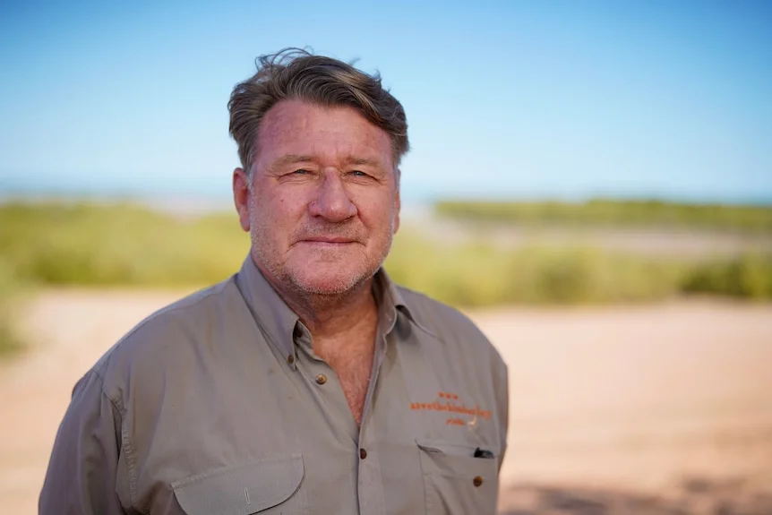 Peter Tucker wears a light brown shirt.