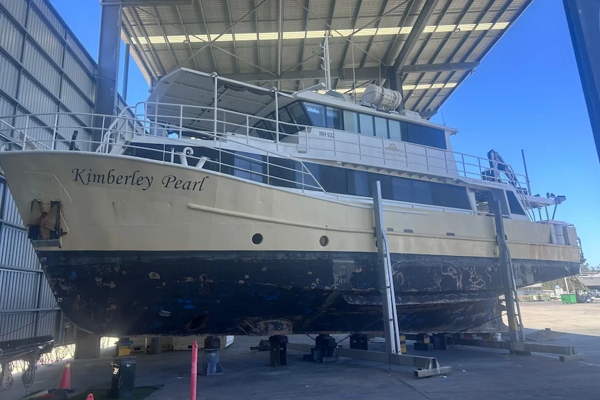 A large boat on a stand.