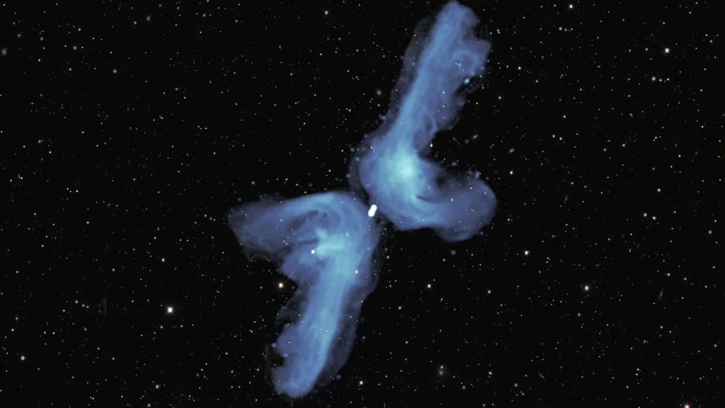 Two lobes are blue and hazy against the darkness of space.