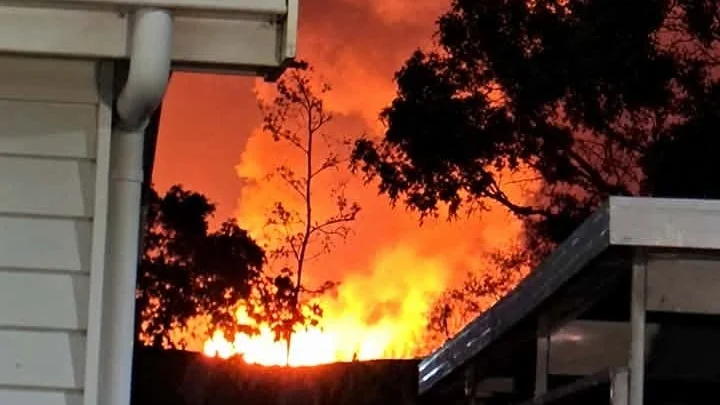 Large fire near housing.