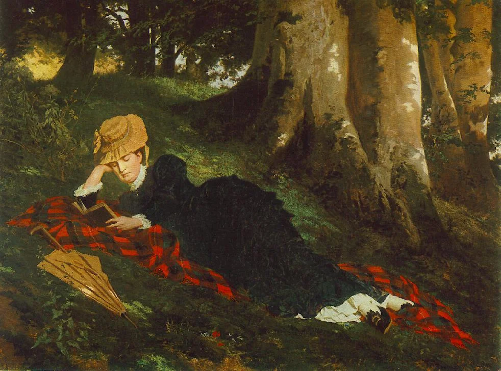 A woman in a dark dress and straw hat lies on a red plaid blanket under trees, reading a book, with a closed umbrella beside her.