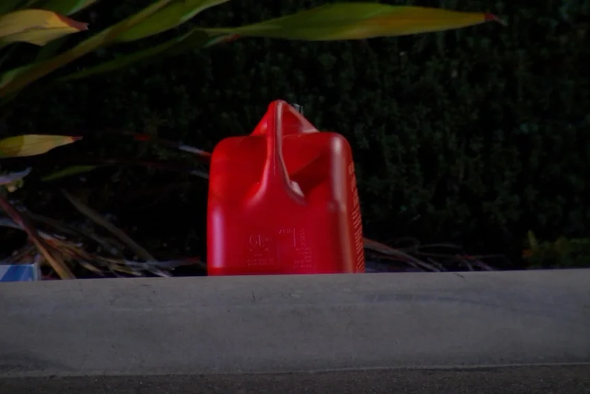 A jerry can on the ground.